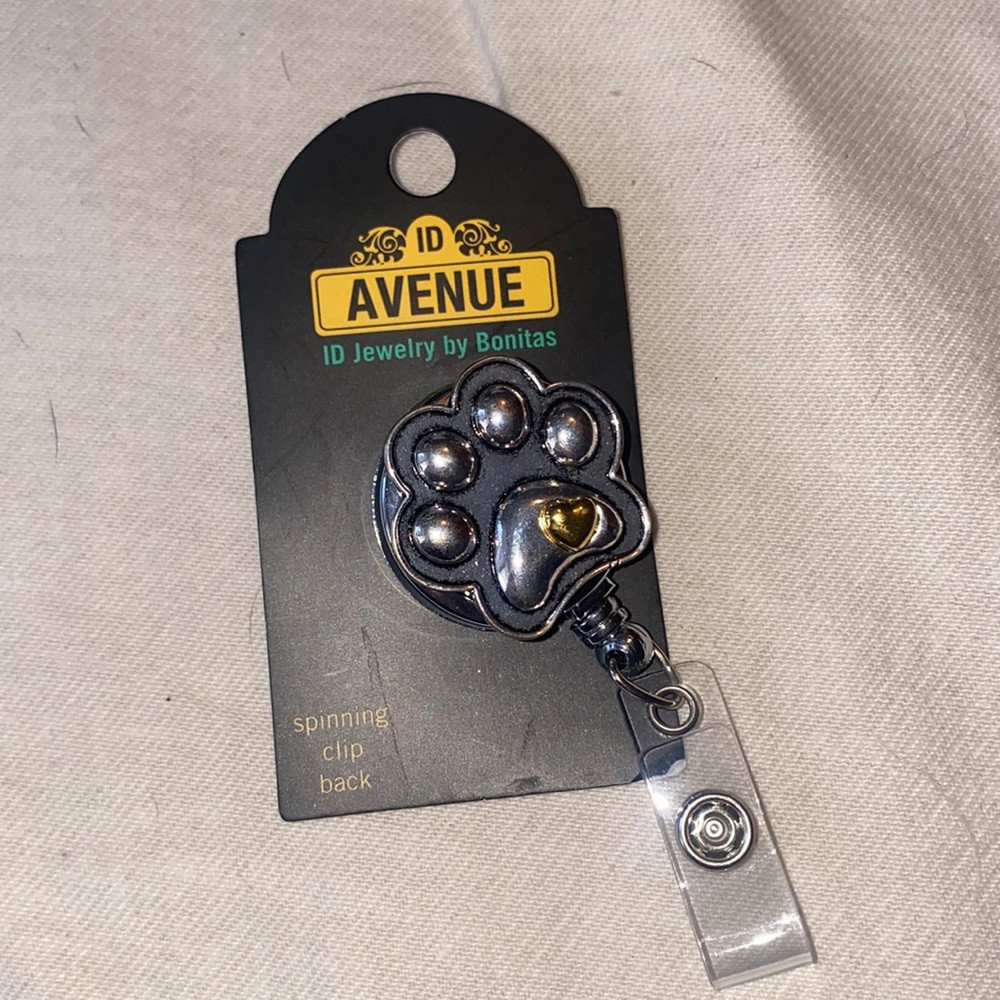 Paw print badge reel